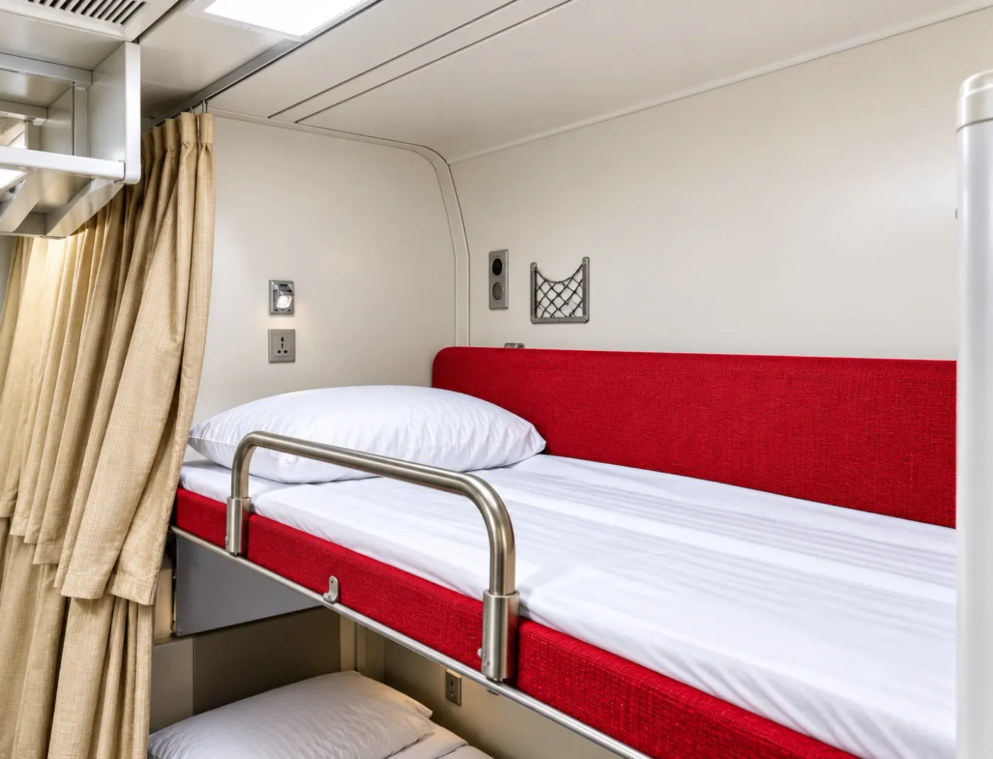 Bunk bed with red bedding in a 20ft VIP accommodation trailer