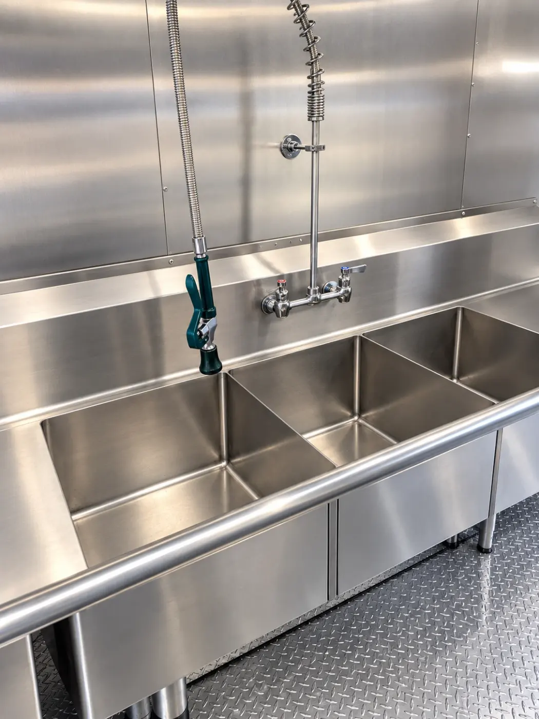 Three-compartment sink in a 26ft baby bulk kitchen trailer