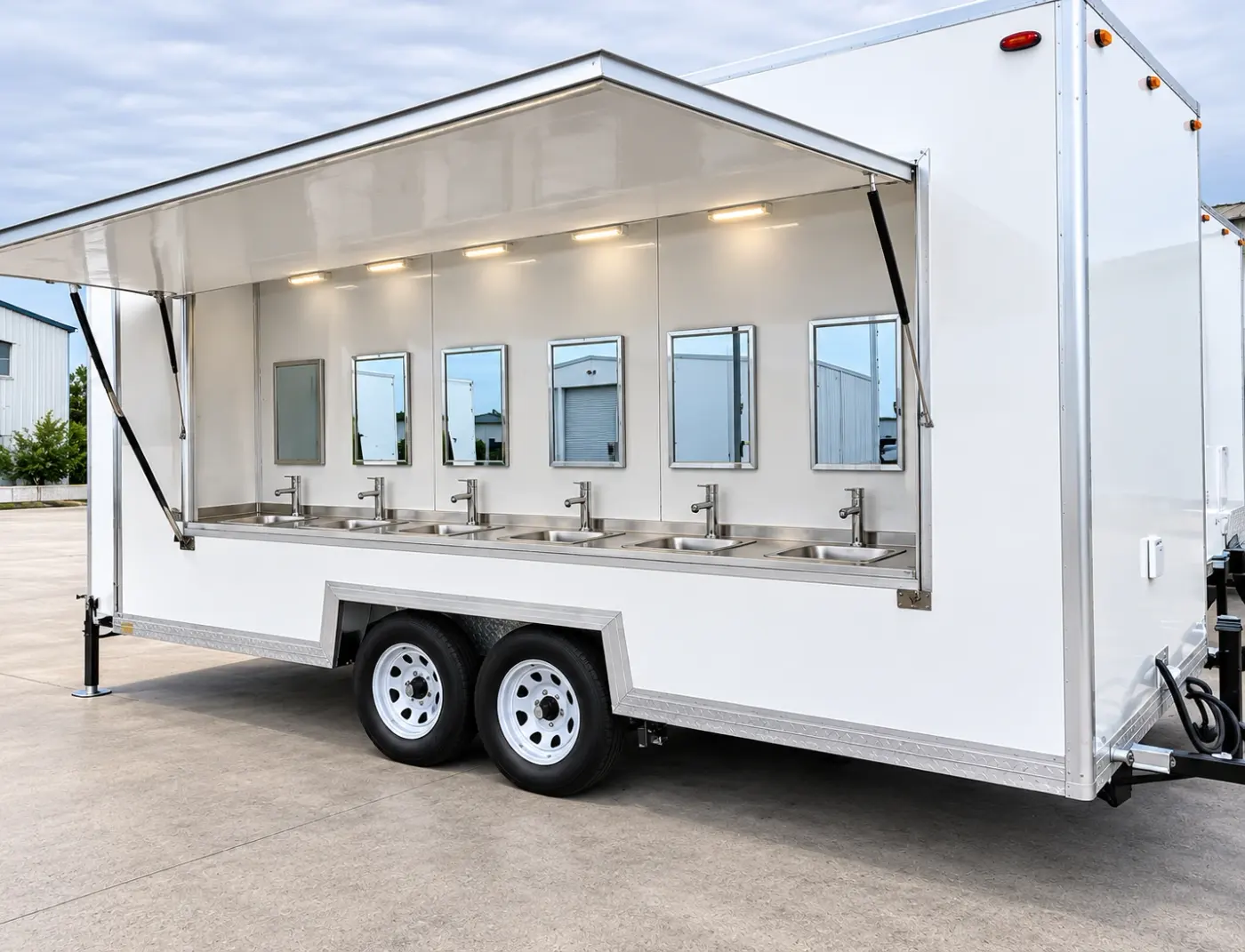Portable handwashing sink trailer with sinks along one side
