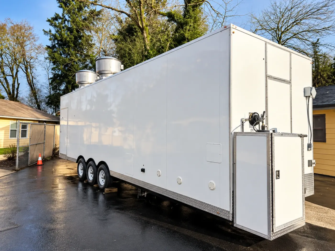 Exterior of a 28ft temporary commercial kitchen trailer with rooftop exhaust fans