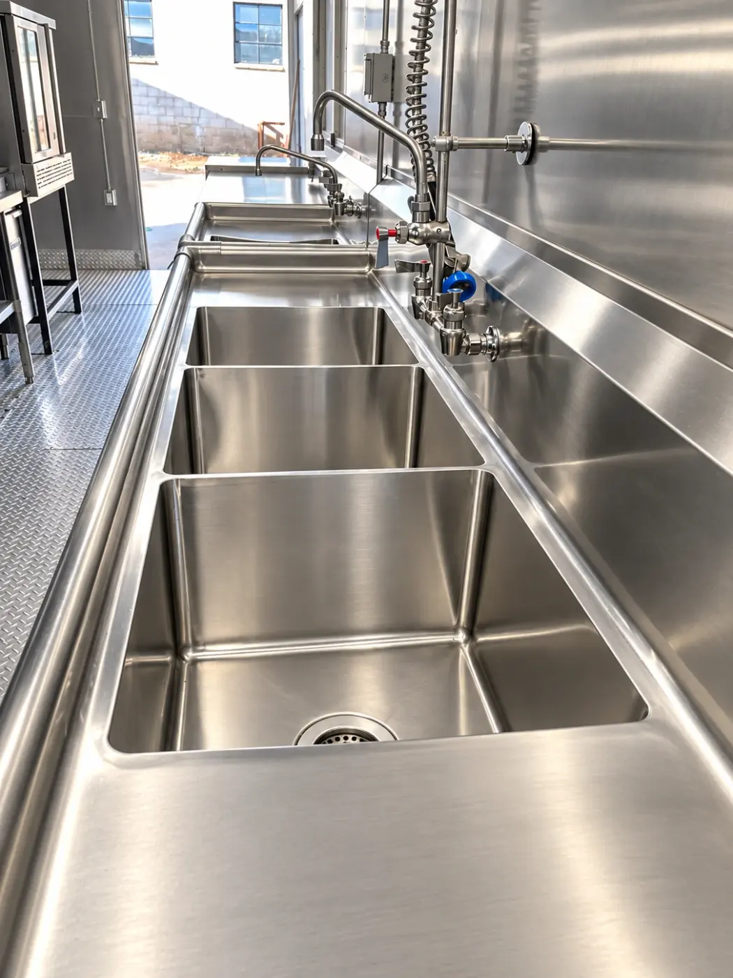 Commercial sink station in a 28ft mobile kitchen trailer