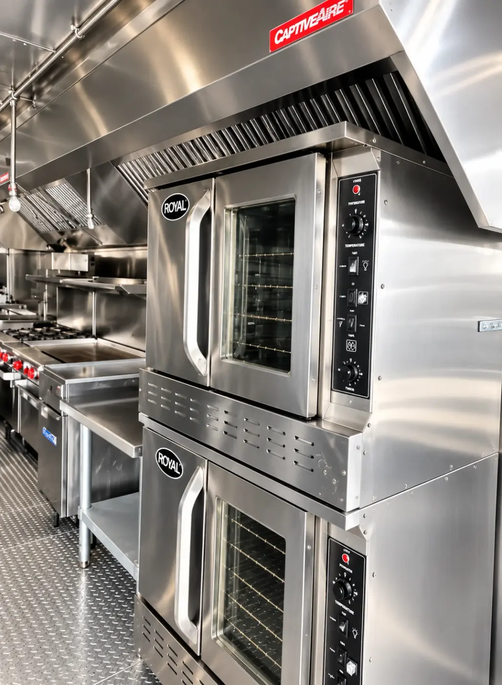 Stacked commercial convection ovens in a 40ft mobile kitchen