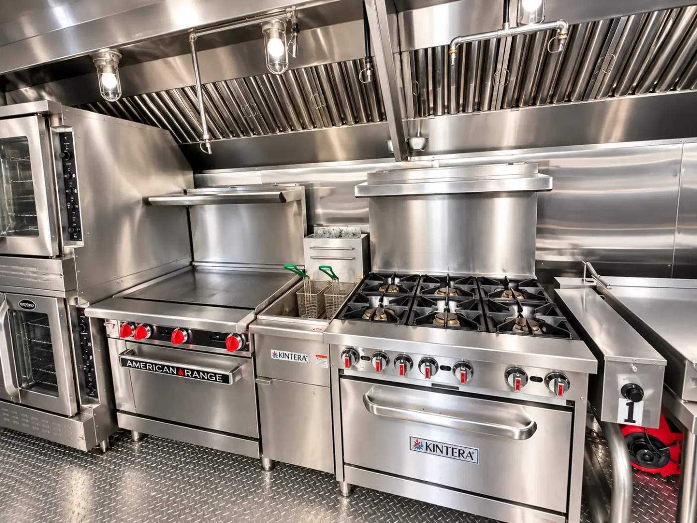 Range, griddle and fryer cooking line in a 40ft bulk kitchen trailer