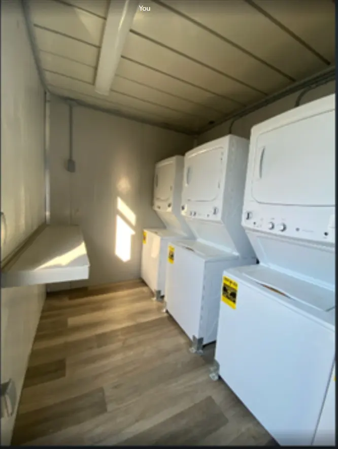 Washers and dryers inside a 20ft laundry container