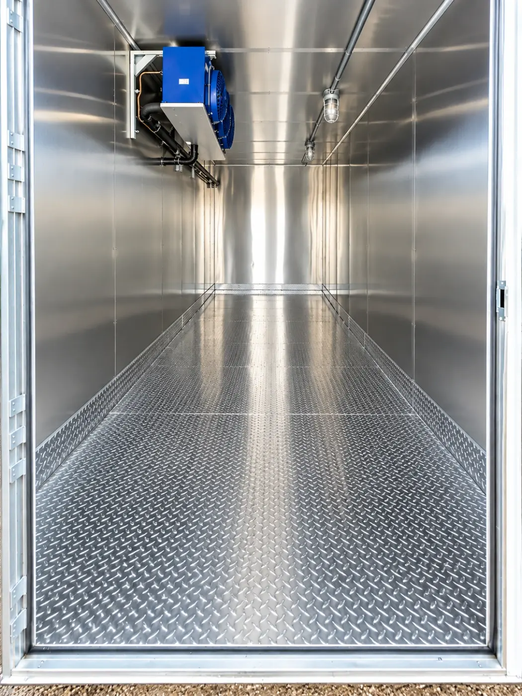 Ceiling-mounted cooling unit inside a 20ft refrigerated unit