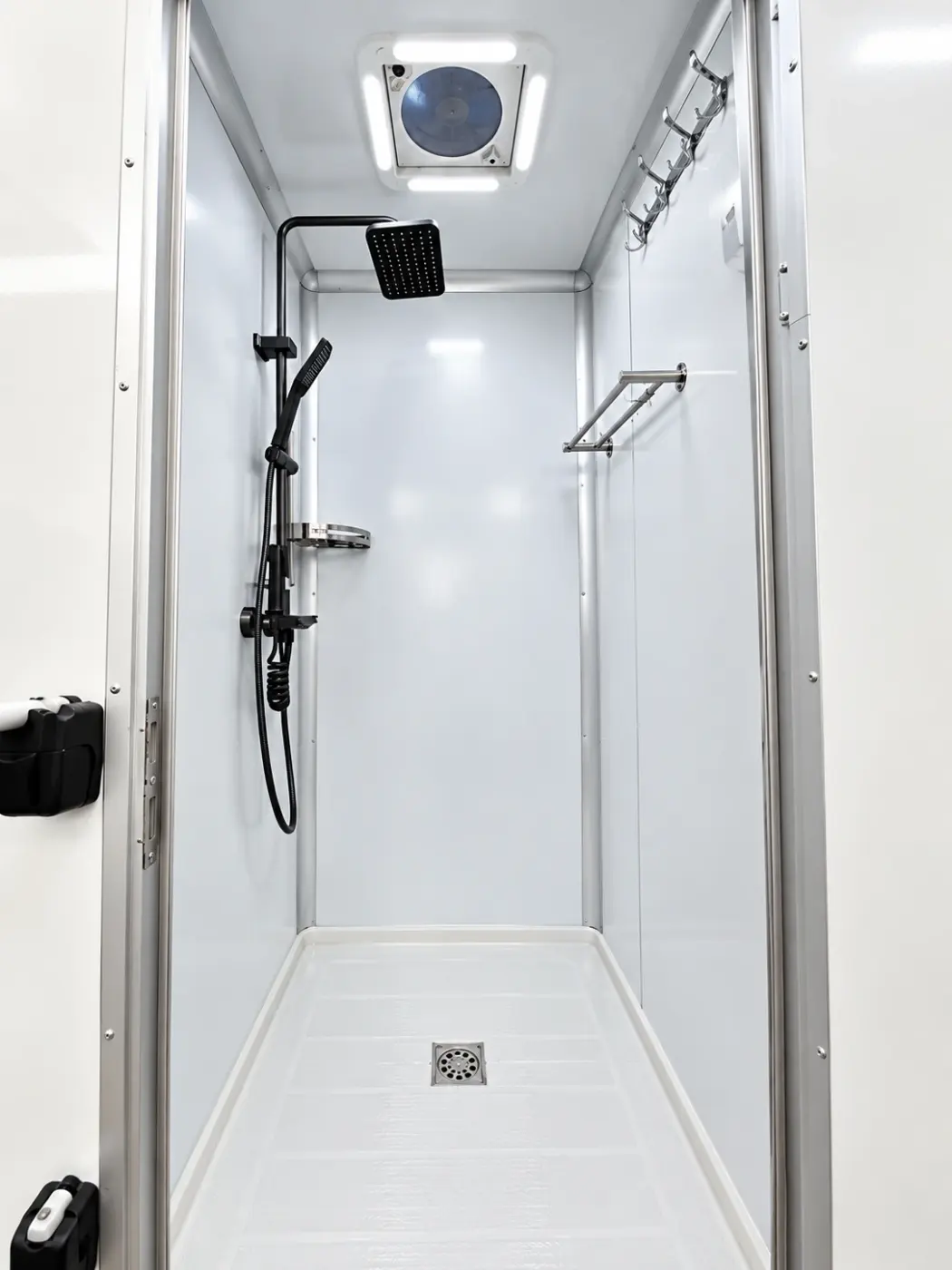 Private shower stall inside a mobile shower trailer