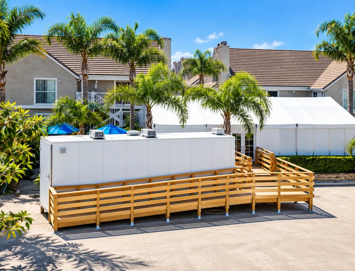 Wooden access ramp beside a temporary facility trailer